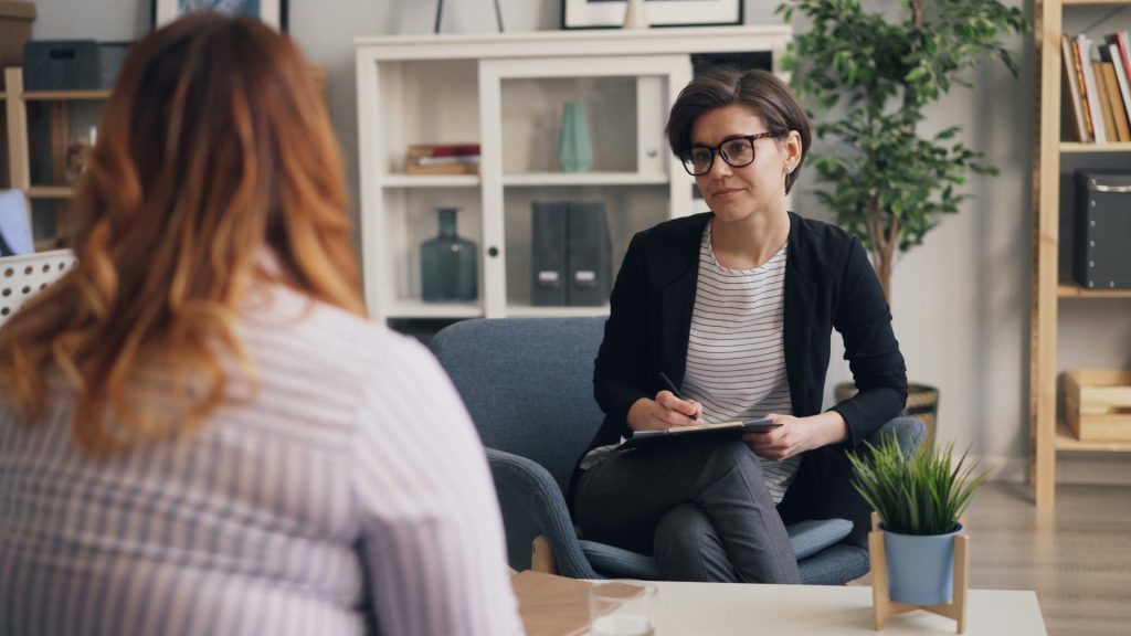 Counselor listening attentively to a client.
